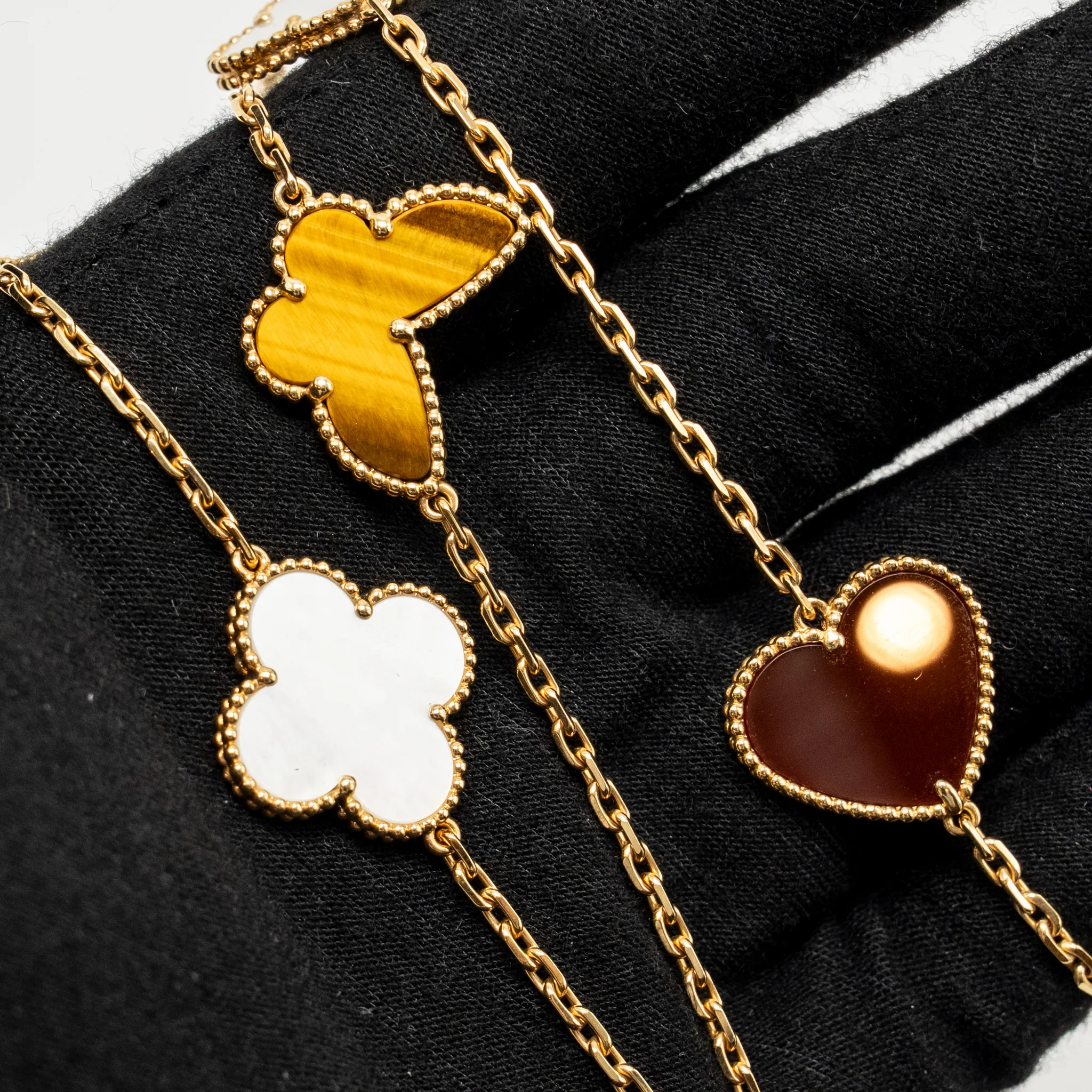 Van Cleef & Arpels Lucky Alhambra Long Necklace, 12 Motifs, Yellow Gold, Carnelian, Malachite, White and Grey Mother-of-Pearl, Tiger Eye - Image 3